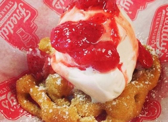 Funnel Cake sundae with strawberry topping.